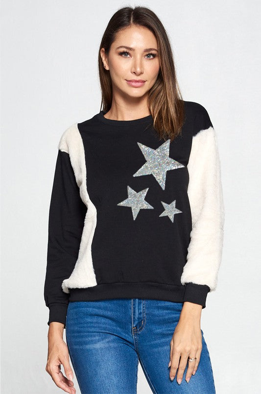 Blusa pull over negro y crema con estrellas